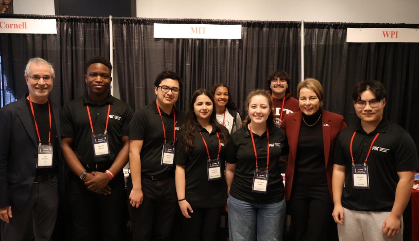 Members of FIRSTxMIT smile with Massachusetts Governor Maura Healey