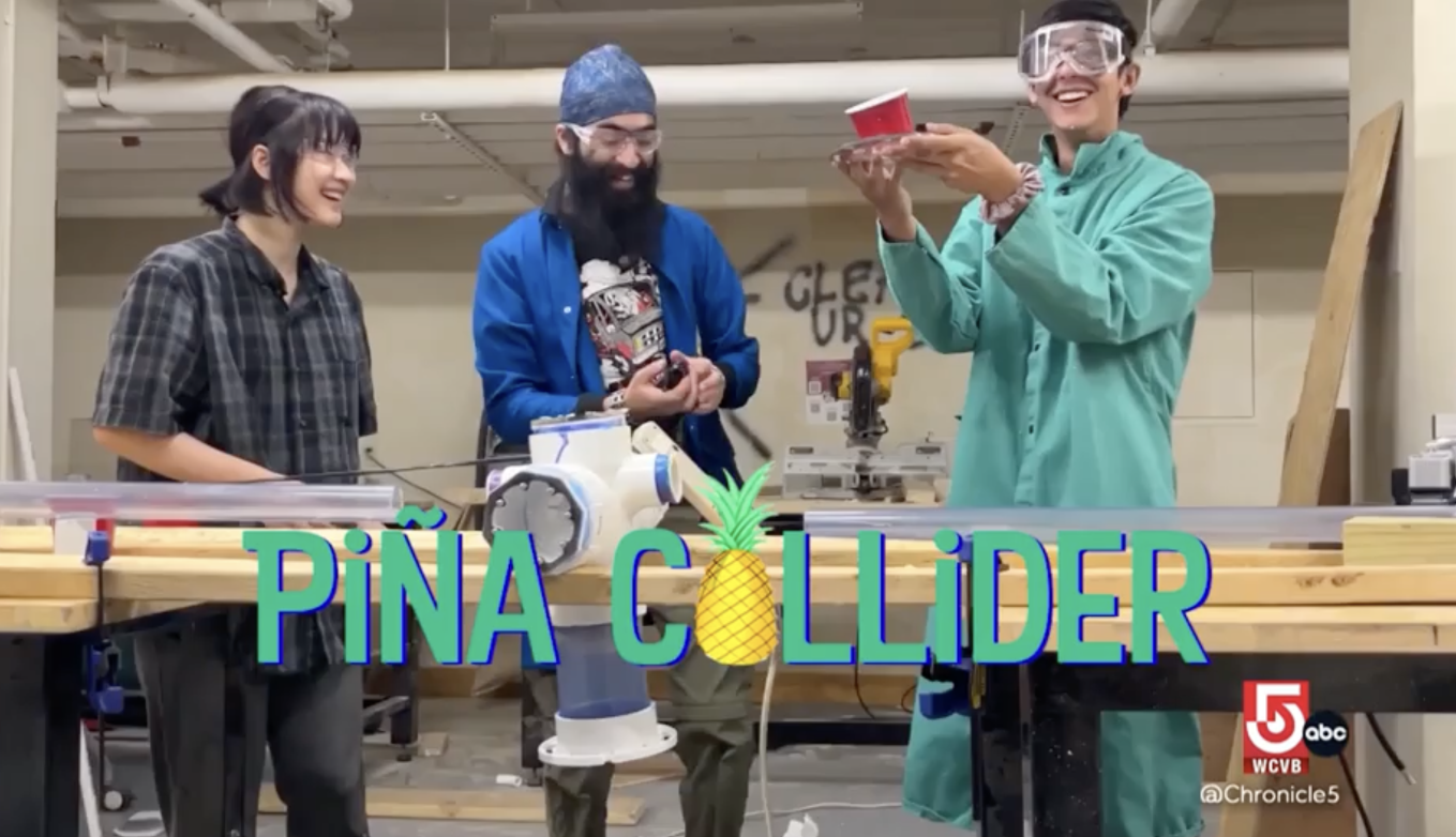 Three students stand behind the experimental Pina Collider