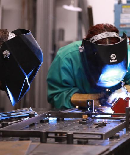Welding instructor and student welding in Metropolis