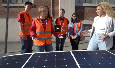 Solar car captain Cameron Kokesh '23 talks to reporter