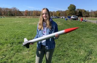 Summer Hoss ‘23 holding a rocket