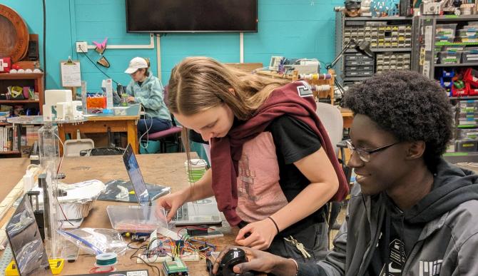 Students collaborate on an electronics project in the 4-409 Makerspace